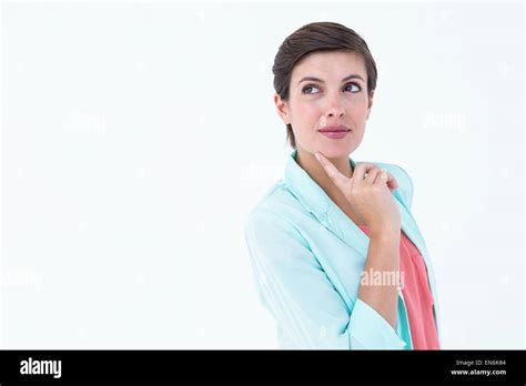 Thoughtful Brunette With Finger On Cheek Stock Photo Alamy
