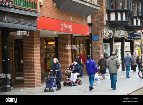 Shoppers On Busy High Street In Exeter Devon England Uk Stock Photo Alamy