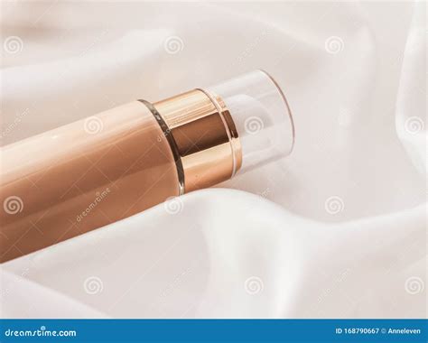 Tonal Bb Cream Bottle Make Up Fluid Foundation Base For Nude Skin Color On Silk Background