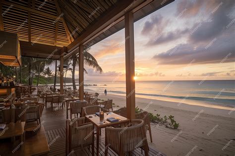 Premium Ai Image Beachside Restaurant With A View Of The Sunset Serving Seafood And Cocktails