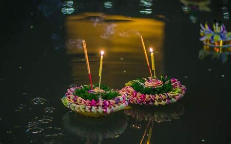 Two Small Candles Are Sitting On The Table