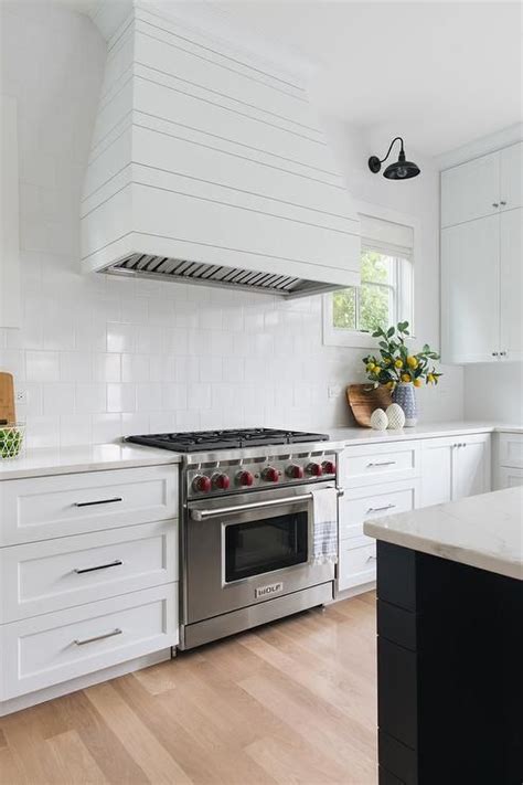 White Plank Range Hood With Square White Porcelain Tiles Transitional