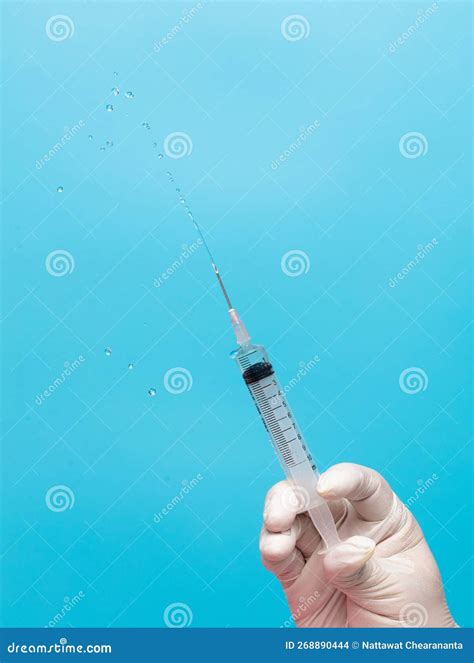 Syringe Inject Serum Cure Drug From Needle Tube And Fly In Air. Syringe