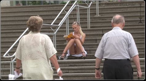 Sitting On The Steps In A Short Dress And Showing Her Pussy