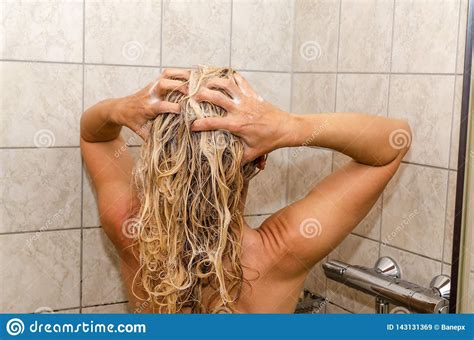 Woman Washing Her Hair Blonde Woman Washing Her Hair In A Shower Cabin Sponsored