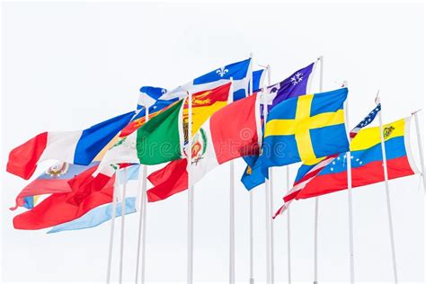 International Flags Of Different Countries Are Hanging On Poles Stock