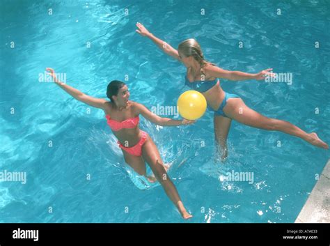 Two Teenage Girls Playing Pool Fotos Und Bildmaterial In Hoher