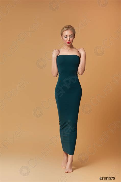 Stunning Slim Blonde Woman In Green Dress Stock Photo Crushpixel
