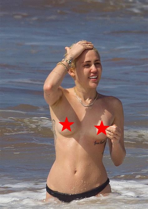 HOT Miley Cyrus Topless At The Beach Showing FULL TITS
