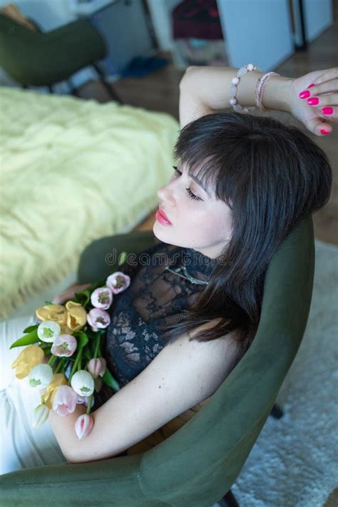 Perfect Brunette Woman With Perfect Skin Big Full Lips Posing At Bedroom Wearing Top Stock