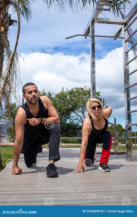 Blonde Lady Exercising With Her Personal Trainer Stock Photo Image Of Couple Class