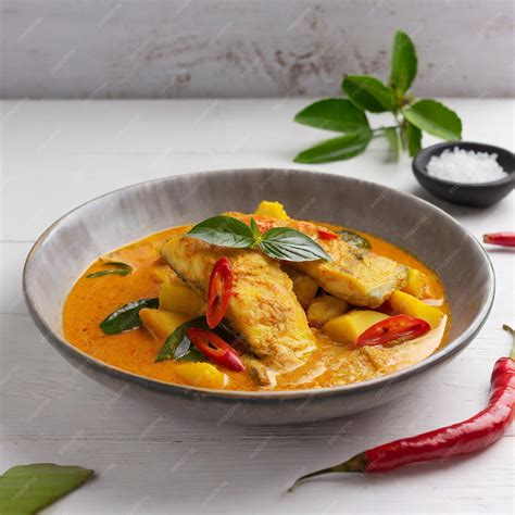 Premium Photo | Spicy fish curry_seer fish curry traditional indian