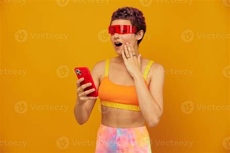 Woman blogger surprise in unusual millennial glasses taking selfies on
