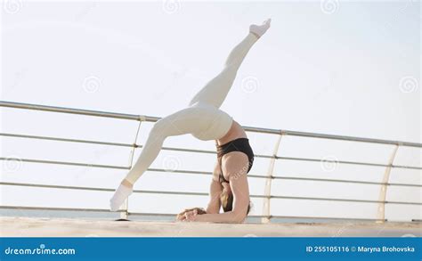 Flexible Female Gymnast Doing Acrobatic Tricks At Sunrise On The Beach Stock Footage Video Of