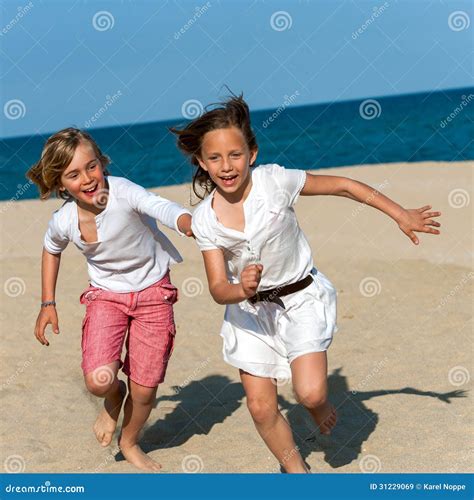 Boy Chasing Girl On Beach Stock Image Image Of Activity 31229069