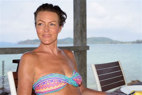 Mature Beautiful Tourist Woman At The Beach Resort Stock Photo Adobe