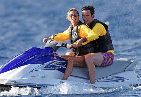 Heidi Klum Takes To The Water In A Jet Ski Before Stripping Down To Her Bronze Bikini Daily