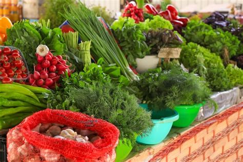 Premium Photo Assortment Of Herbs And Vegetables On Counter At Market