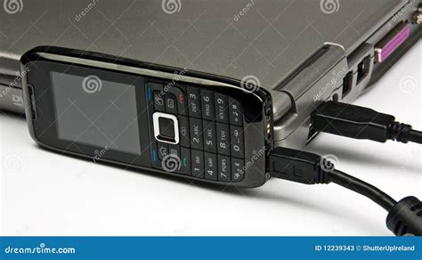 Concept Phone Connected To Laptop Via Usb Cable Stock Image Image Of