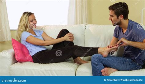 Caring Boyfriend Giving His Blonde Girlfriend A Foot Rub Stock Footage Video Of Household