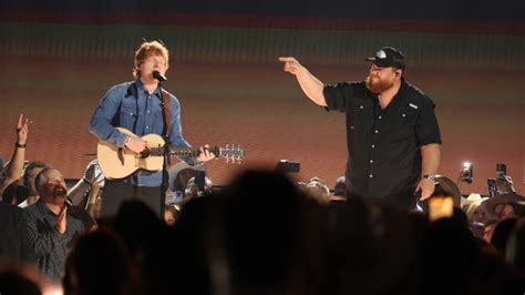 Watch Luke Combs teach pop star Ed Sheeran how to shotgun a beer | ABC Audio Digital Syndication