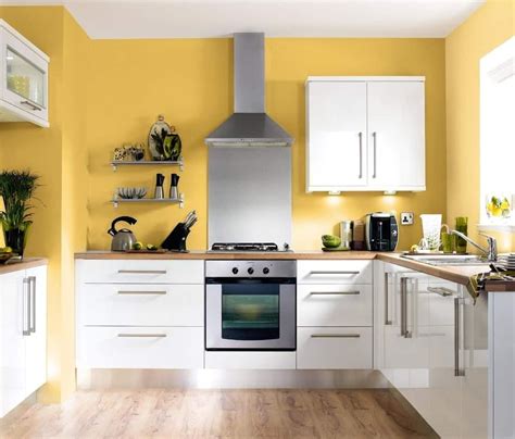 Sleek Kitchen Boasts White Cabinetry And Floating Shelves Fixed Against