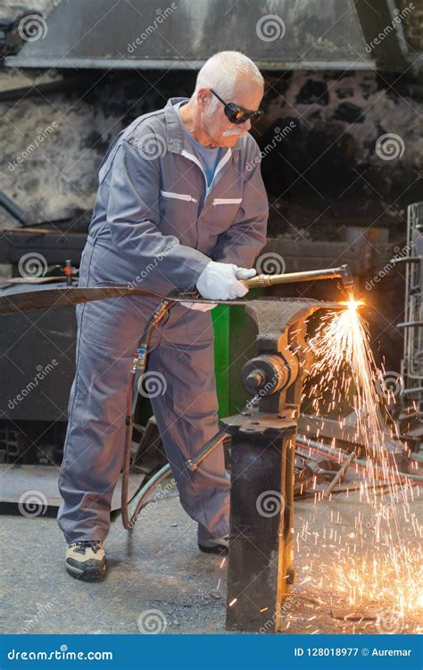 Old Worker Repairing Old Transformer And Welding Copper Wire Stock