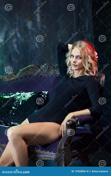 Beautiful Blonde Woman In A Black Bodysuit Beauty Portrait Of A Girl Clean Delicate Skin Of