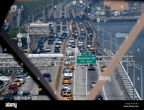 Commuters In Their Cars In Rush Hour Traffic Jam Viewed From The