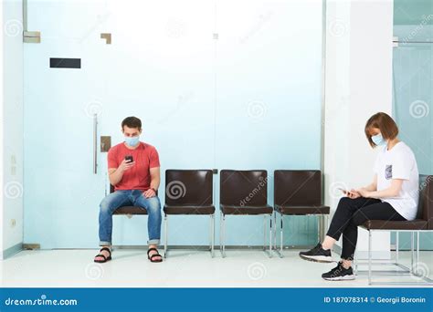 young people  medical masks sitting   queue  waiting