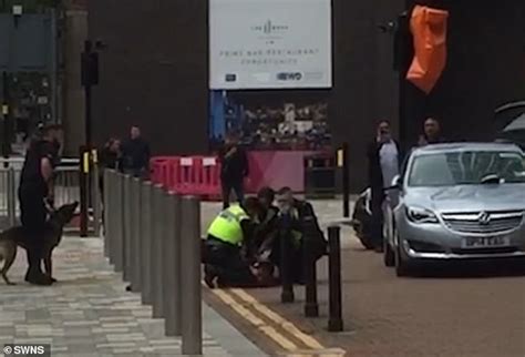 Police Arrest Semi Naked Man After Pulling Him Down From Car Roof Daily Mail Online