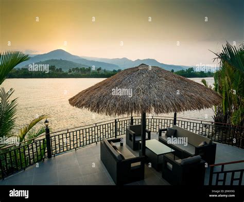riverside sunset view  kampot cambodia asia  relaxing deck sofa