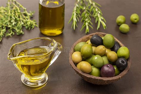 Olives Of Various Varieties In Coconut Shell Olive Oil In Bowl And