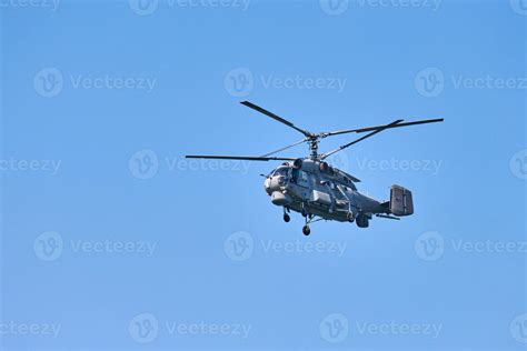 Navy Helicopter Flying Against Blue Sky Background Copy Space One