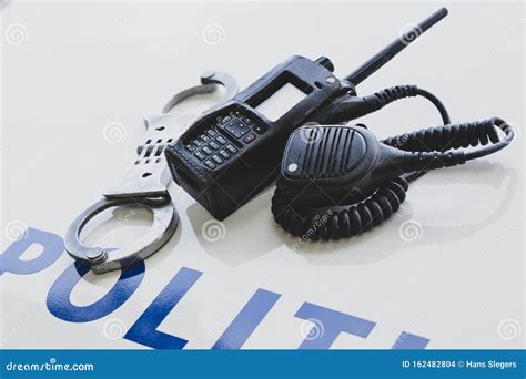 Police Equipment with Handcuffs on a Police Car Stock Photo - Image of ...