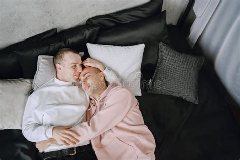 Happy Gay Couple Lying On Bed At Home Stock Image Image Of Indoors Caucasian