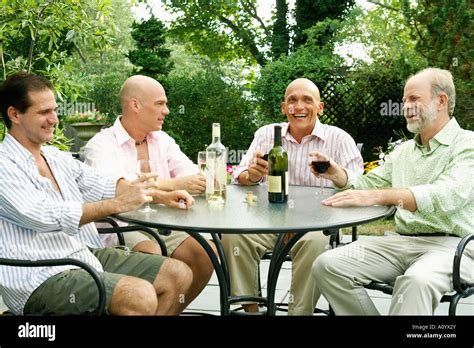 Two Gay Couples Drinking Wine Together Stock Photo Alamy