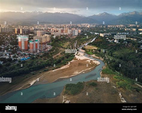 Aerial Drone Shot Of Big Almaty River And Sayran Lake With Skyscrapers