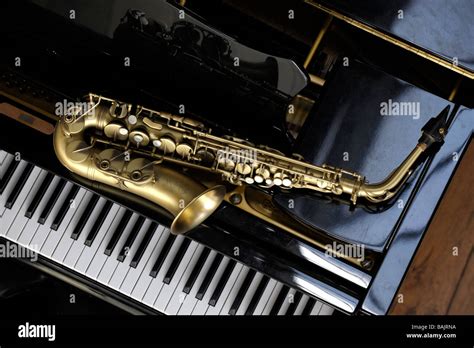 Alto Saxophone Lying On A Grand Piano Stock Photo 23770694 Alamy