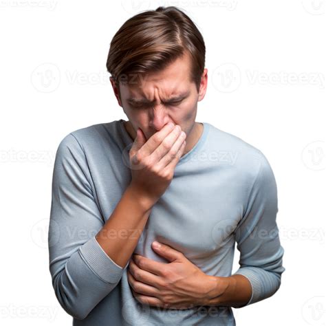 Young man feeling nauseous with hand on stomach and covering mouth on a