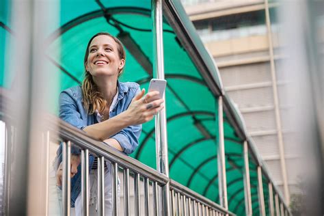 Woman Using Phone In The City By Stocksy Contributor Jovo Jovanovic Stocksy