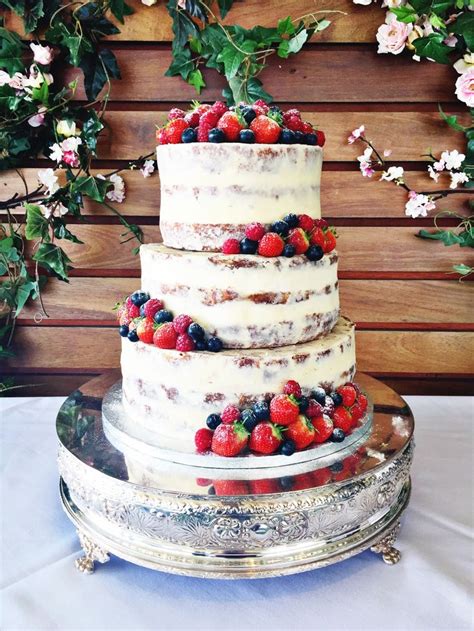 Semi Naked Wedding Cake With Fresh Berries And Dusting Of Powedered Sugar Wedding Cake Rustic