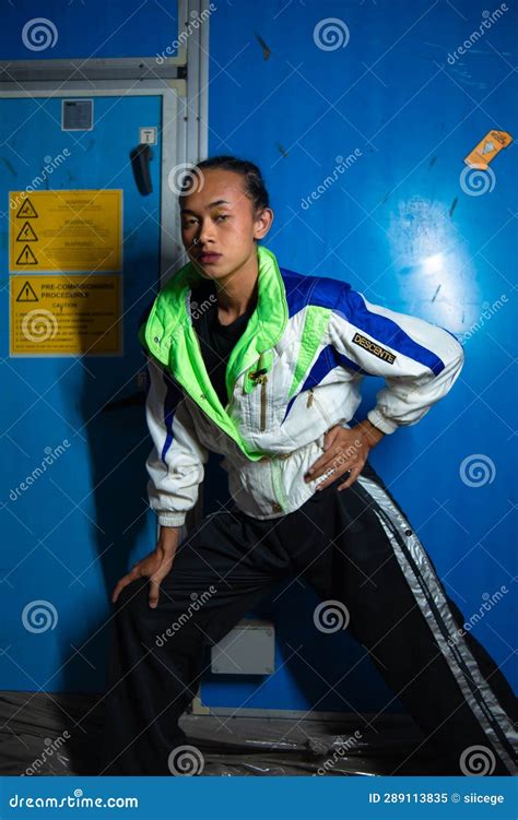 A Gay Asian Man Posing Beautifully Against A Blue Background Stock Image Image Of Attitude