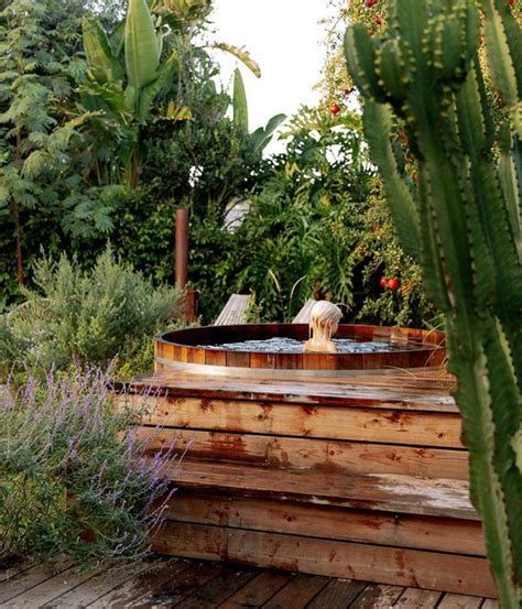 Outdoor Hot Tub Oasis In A Lush Backyard Garden