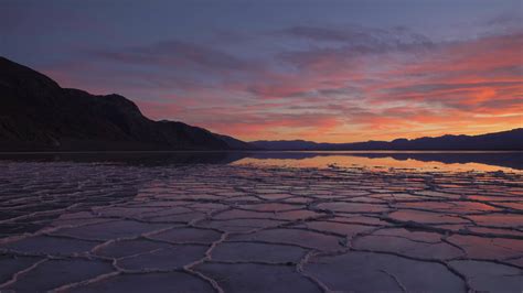 Badwater Basin at Sunset. Salt Crust and Sky Reflection. Death Valley National Park. California ...