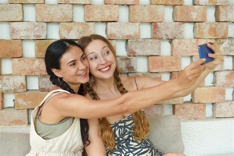 Premium Photo Ukrainian Woman Brunette And Russian Woman Blonde Portrait Together With Braids