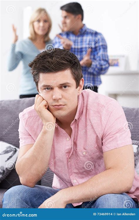Mature Parents Frustrated With Adult Son Living At Home Stock Photo Image Of Mother Annoyed