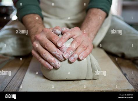 Mid Section Of Male Potter Molding Clay Stock Photo Alamy