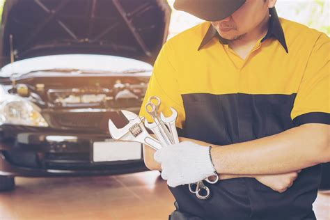 Mechanic Man Repairing Car Stock Photo At Vecteezy