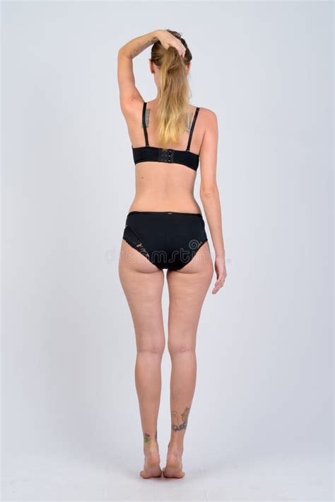Full Body Shot Rear View Of Blonde Woman In Bikini Holding Hair Up Stock Photo Image Of Back